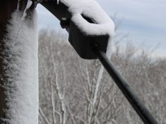 stabilizer metal cable support on copper falls national park observation tower, and a connected cursive encircled JTL in the lower corner of the support
